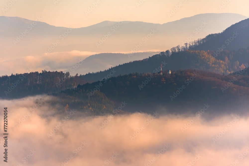 Beautiful view of the hills hidden in fog at sunset. Banska Bystrica, Slovakia. Beautiful view of the hills hidden in fog at sunset. Banska Bystrica, Slovakia.