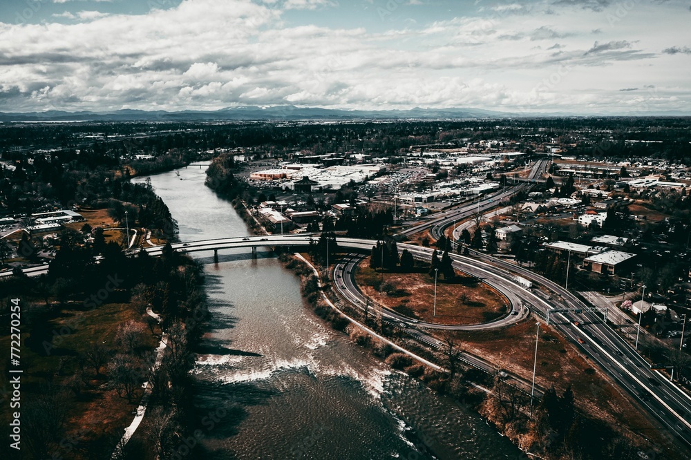 Aerial view of a freeway bridge crossing over a river in Eugene