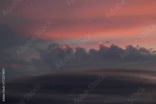 Scenic view of a sunset sky filled with stormy clouds. photo