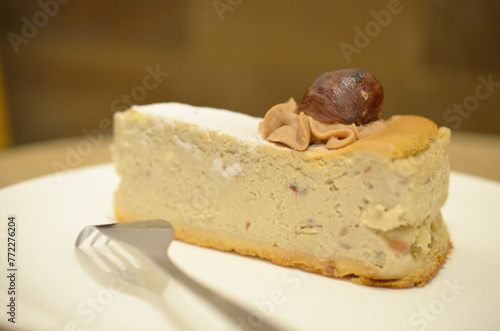 a white plate of a Castanea Cheesecake