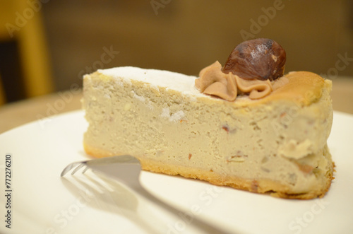 a white plate of a Castanea Cheesecake