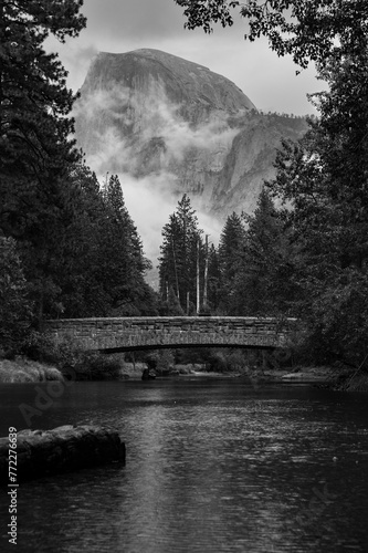 Greyscale shot of the Sentinal Bridge with the Half Dome batholith in the background, Yosemite photo