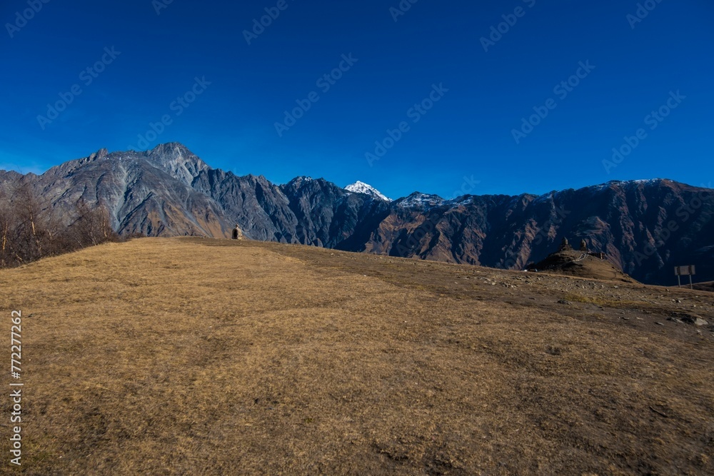 View of an ancient castle situated atop a mountain in Kazbegi, Georgia