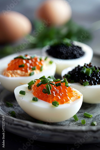 Boiled eggs with red and black caviar
