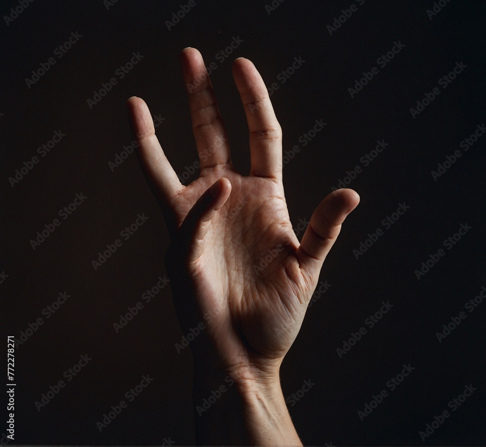 Female hand on a dark background, showing the number five. Studio shot. Female hand on a dark background, showing the number five. Studio shot.