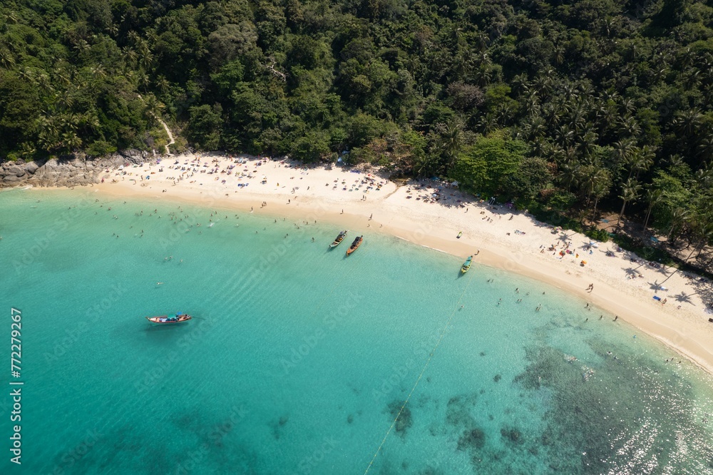 Aerial view of Freedom Beach in Phuket, surrounded by lush tropical vegetation Aerial view of Freedom Beach in Phuket, surrounded by lush tropical vegetation