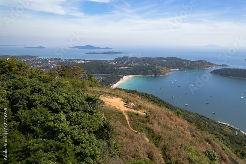 Aerial view of Nai Harn Beach in Phuket, surrounded by lush tropical vegetation