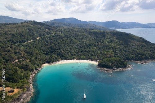 Aerial view of Freedom Beach in Phuket, surrounded by lush tropical vegetation © Wirestock