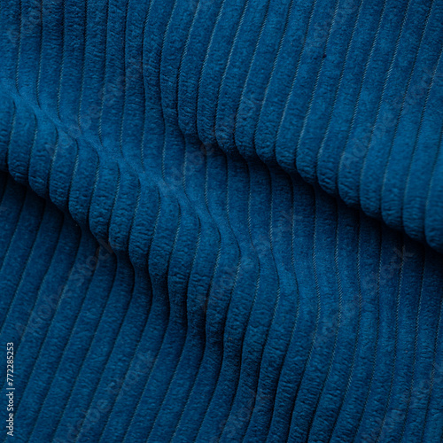 Closeup detail of blue fabric texture background. High resolution photo.