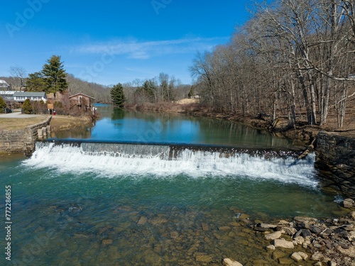 Aerial view of the Bruceton Mills waterfall gracefully flowing through a small town in West Virginia photo