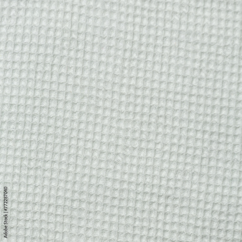 Closeup detail of beige fabric texture background. High resolution photo.