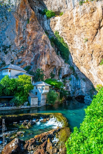 Historic Dervish House on the side of a cliff near a stream in Blagaj, Bosnia and Herzegovina