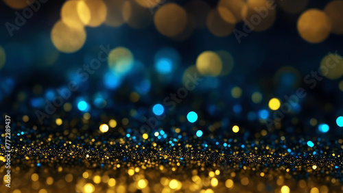 Golden light shine particles bokeh on navy blue background. 