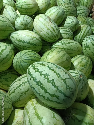 Watermelon is a flowering plant species of the Cucurbitaceae family and the name of its edible fruit.  photo
