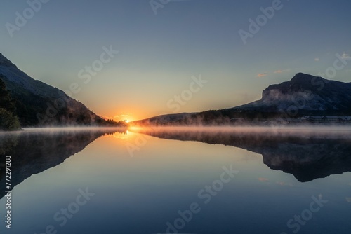 Beautiful sunrise over Swiftcurrent Lake in Glacier national park photo