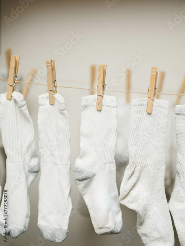 White socks clipped to rope to dry
