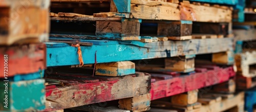 Close-up view of a stack of wooden pallets piled on top of each other.