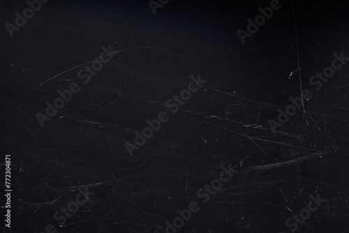 Close up view of an abstract background with white scratches isolated on black background with empty, copy space. Template, mock up, overlay for your design, art.