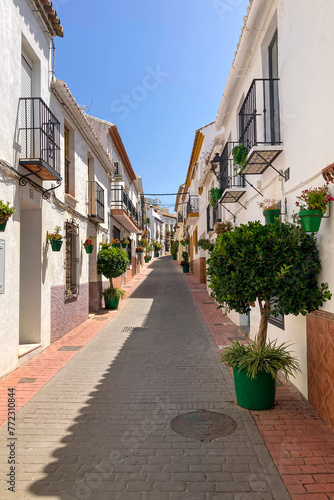 Walking in city center on sunny summer day in Estepona  Spain