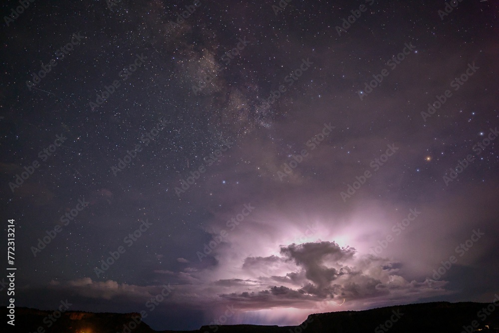 Silhouetted rock formation against a dark night sky, creating a stunningly beautiful contrast Silhouetted rock formation against a dark night sky, creating a stunningly beautiful contrast