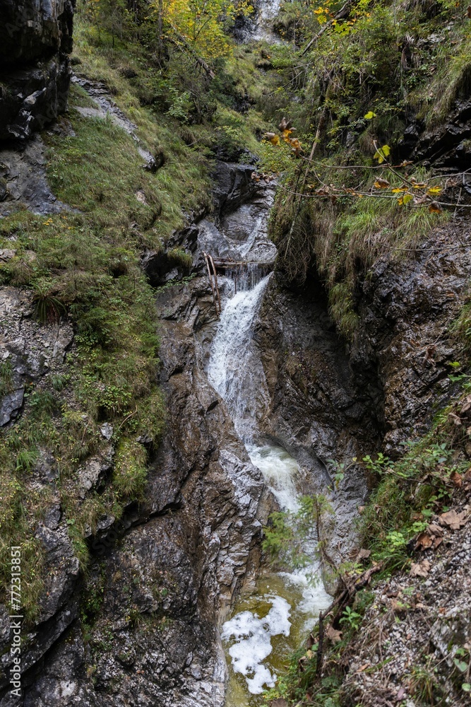 Idyllic river cascading down into a rocky ravine, Berge, Pintauer Saalachtal Idyllic river cascading down into a rocky ravine, Berge, Pintauer Saalachtal