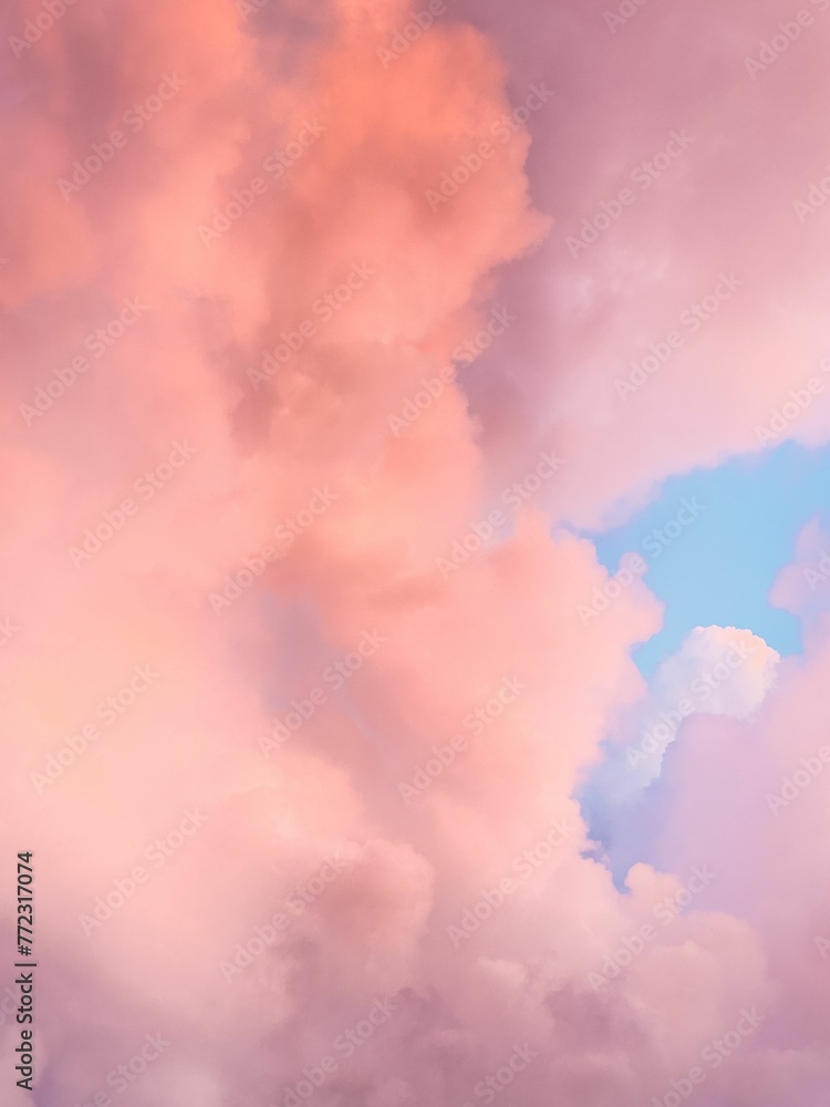 Romantic scene oda rosy-hued sky dotted with fluffy clouds