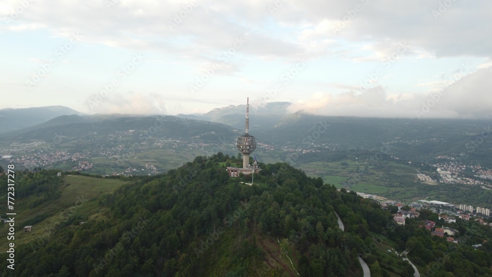 Aerial view of lush green and mountains on a sunny day in Bosnia