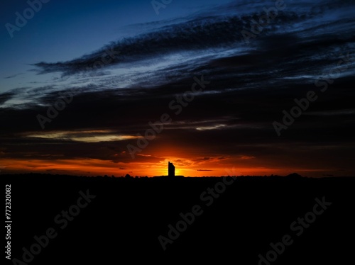 Sunrise over the Balgone Barns windmill tower ruins near North Berwick, East Lothian, Scotland photo