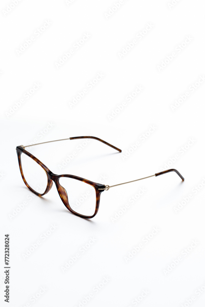 beautiful glasses with thin frames on a white background beautiful glasses with thin frames on a white background