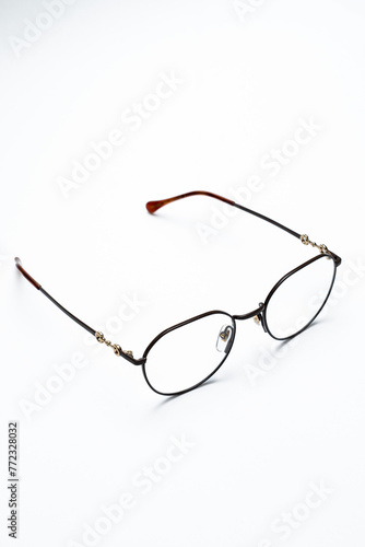 beautiful glasses with thin frames on a white background