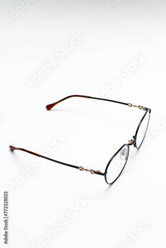 beautiful glasses with thin frames on a white background