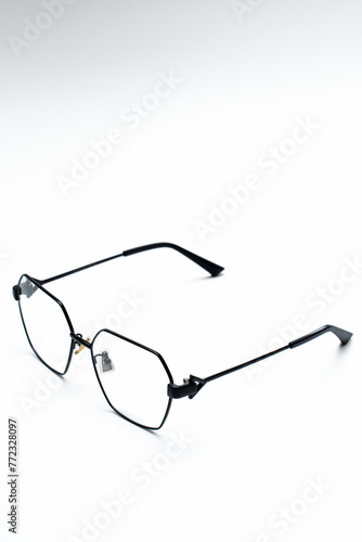 beautiful glasses with thin frames on a white background