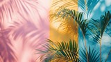 Vibrant tropical palm leaves casting shadows on a multi-hued pastel background, giving a fresh summer feel. Minimal summer concept with copy space. 
