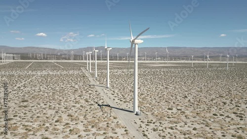 4K Aerials of the windmill farm in Palm Springs, California at the foot of the San Jacinto Mountains, adjacent to Highway 111, which helps provide energy for the Coachella Valley in Riverside County.