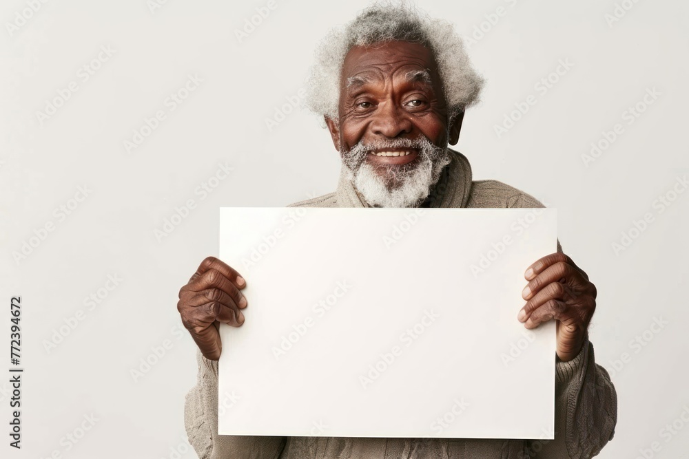 smiling old afro man holding a large white blank card with space for text, graphic or text on white background smiling old afro man holding a large white blank card with space for text, graphic or text on white background