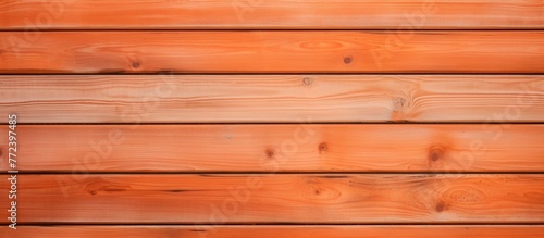 Closeup of amberbrown hardwood plank wall with blurred background