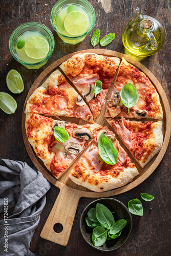 Spicy Capricciosa pizza with cheese, mushrooms and ham.