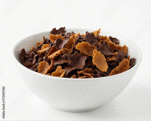 Chocolate corn flakes in a bowl ,cut out on white background