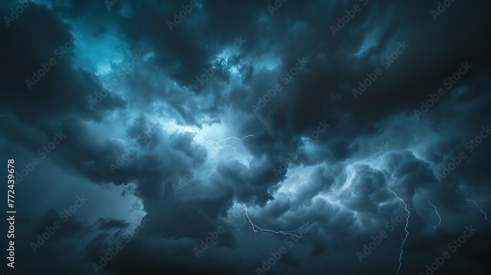 The dark sky with heavy clouds converging and a violent storm before the rain. Bad or moody weather sky and environment. carbon dioxide emissions, greenhouse effect, global warming, climate change.