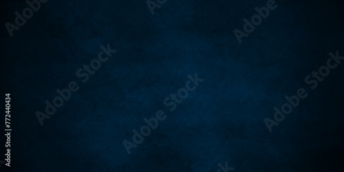 Dark and light blue wall grunge backdrop texture. watercolor painted mottled blue background, modern colorful concrete dirty smooth ink textures on black paper background. photo