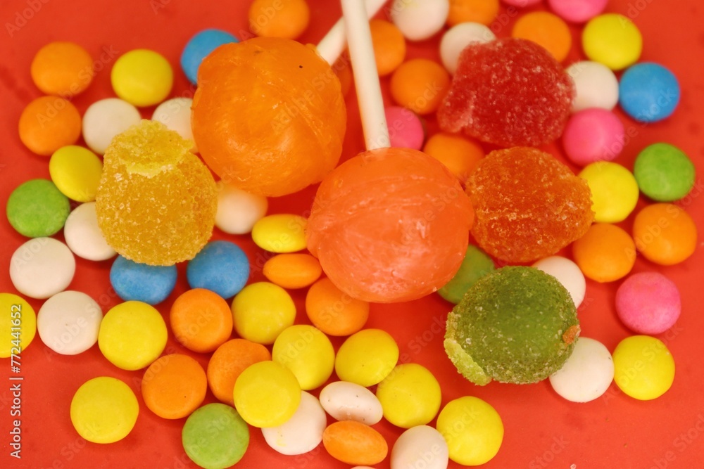 Delicious candy and Gems on the red background Delicious candy and Gems on the red background