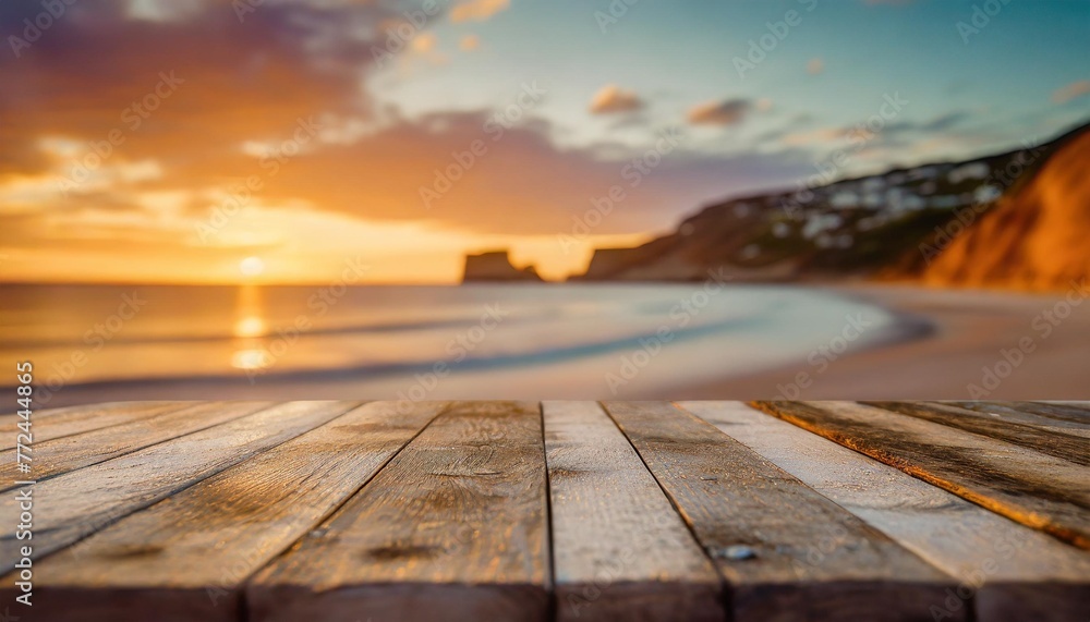 a beachy vibe old wooden table with a blurred coastal background