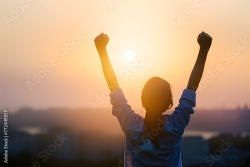 Person raises arms in triumph  celebrating success and achievement