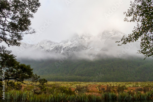 Photograph of snow on a large mountain range in Fiordland National Park on the South Island of New Zealand