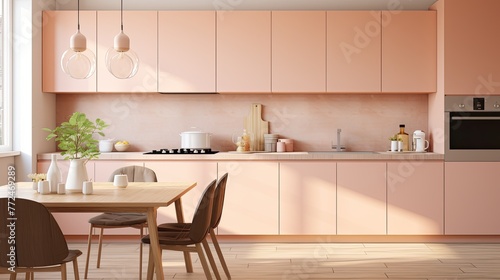 An inviting kitchen space with pastel peach cabinets and modern appliances.