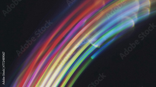 Crisp, prismatic light rays fan out against a dark background, reminiscent of a high-tech light show.