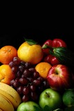 A close up of a variety of fruit on a wooden table. Ideal for healthy eating concepts