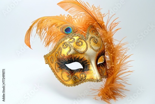 Intriguing image of a gold mask with feathers and a striking blue eye, perfect for mysterious and elegant designs