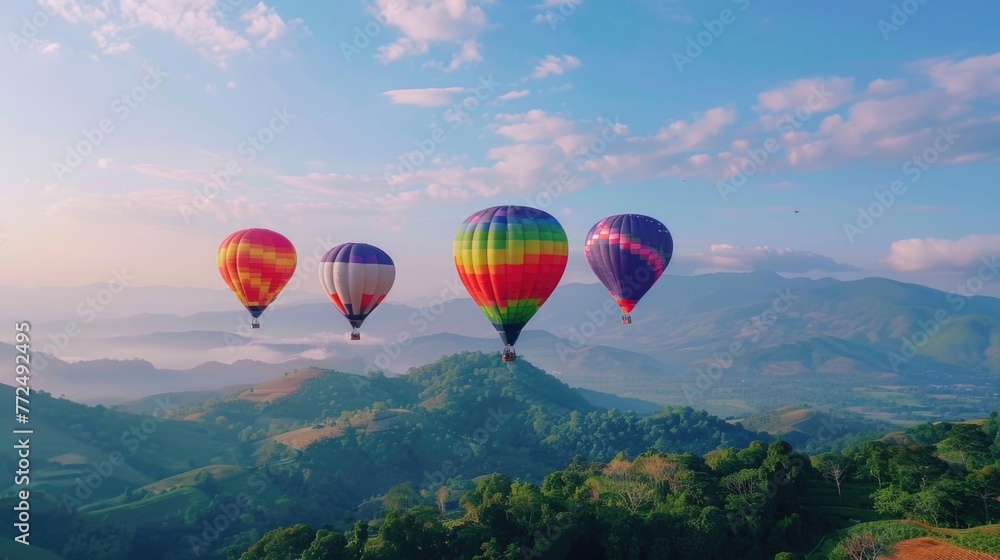 A group of hot air balloons soaring over a picturesque green hillside. Perfect for travel and adventure concepts