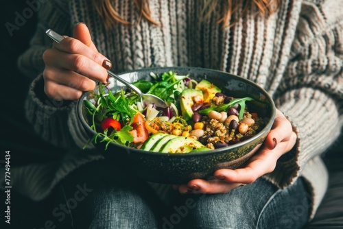 A woman holding a bowl of food, perfect for food blogs or recipe websites